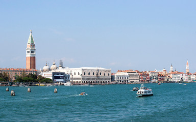 Doges palace Marco lion statue  and water traffic in summer Venice