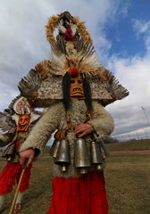 Obraz premium Elin Pelin, Bulgaria - February 15, 2020: Masquerade festival in Elin Pelin, Bulgaria. People with mask called Kukeri dance and perform to scare the evil spirits.