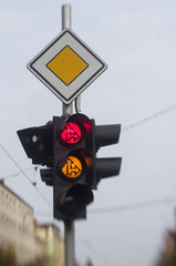 Red and orange traffic lights in the city
