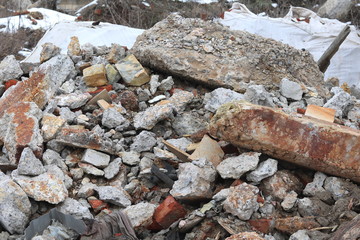 Construction waste with elements of various dismantled and destroyed old structures at municipal landfill