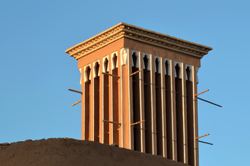 Badgir, a wind tower on the roof in the ancient city of Yazd in Iran, badgir is a traditional...
