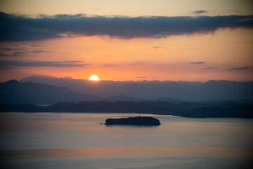 sunset over the sea in the mountains