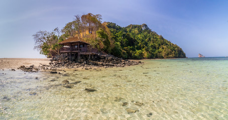 tropical beach in thailand with a beach hut