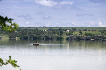 Beautiful summer landscape in the wide river.