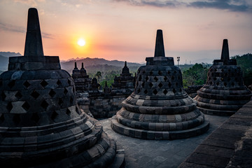 sunset at borobudur with stupas