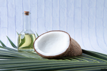 coconuts and Coconut oil  in a bottle  for cooking   nutrition  vegan ingredient  natural put on a white table,