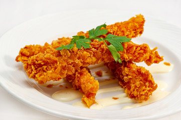 Breaded chicken drumsticks with Krispies and mustard sauce