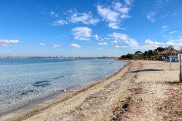 Fototapeta na wymiar Beach on a sunny day in the middle of winter in Taranto, Puglia, Italy