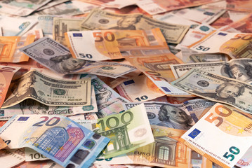Background made of dollar, euro and russian roubles banknotes