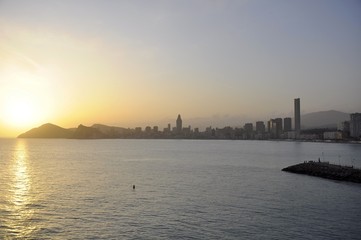 Coastal city in the sunset light