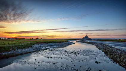 Naklejka premium Mont-Saint-Michel is the name of a tidal island located off the coasts of Normandy and Brittany, near the mouths of the Couesnon
