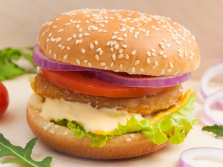 Burger with chicken cutlet on a wooden Board