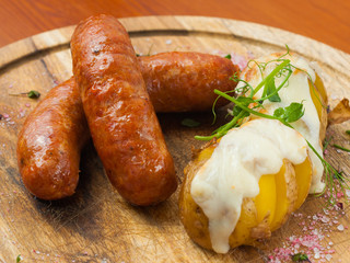 chorizo sausages with potatoes baked under cheese