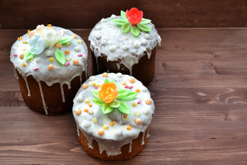 Easter cake kulich. Party food on wooden table, mix kulich