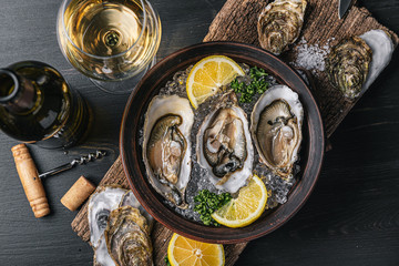 Fresh oysters with lemon ice and white wine.
