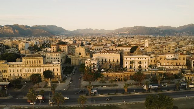 Cinematic flying on an early sunny morning along the promenade, and city traffic in the historic part of Palermo. Aerial shoot