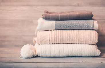 Obraz na płótnie Canvas Stack of cozy knitwear in winter time