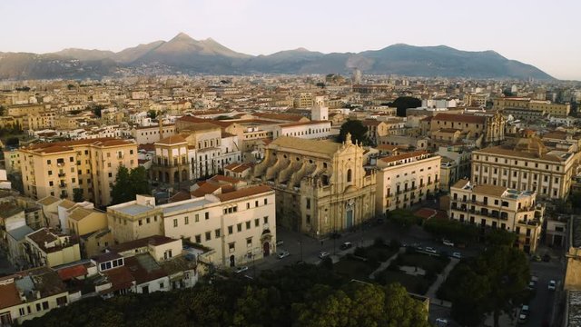Cinematic flying on an early sunny morning over an old Baroque Church's in the historic part of Palermo. Aerial shoot