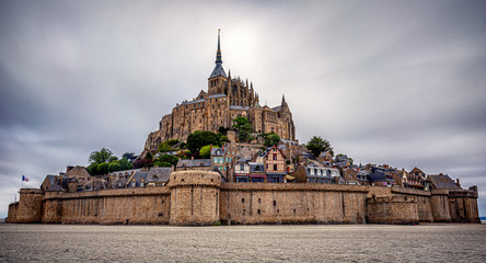 Mont-Saint-Michel is the name of a tidal island located off the coasts of Normandy and Brittany,...
