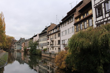 Fototapeta na wymiar Traditional Alsatian timber framed houses on the banks of River Ill in Petite France, Strasbourg, France.