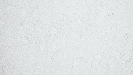 White background. Textured wall. Grainy plaster surface.