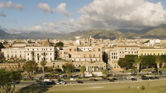 Cinematic flying on an early sunny morning over an old Baroque Church in the historic part of Palermo. Aerial shoot