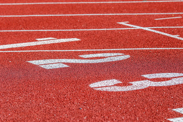 Red running sport track background and texture. Sport running track concept.