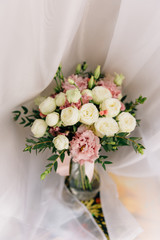 wedding bouquet of the bride in gentle colors
