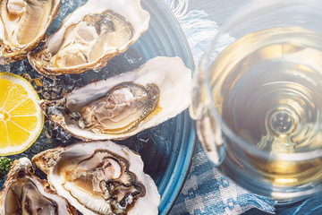 Fresh oysters with lemon ice and white wine.