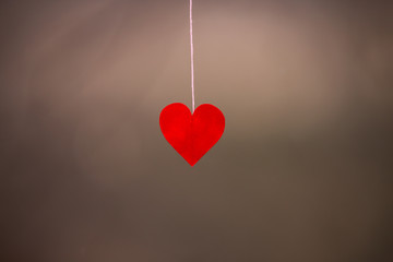 Red heart-shaped paper cut Hanging with pink rope