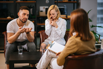 caucasian couple has a crisis in relationships, they want to save and prevent mistakes made by each other, don't want to get divorced and attend such therapy every month. people, family, love concept