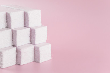 Sweet pink marshmallow rectangular shape in the form of a geometric shape with copy space