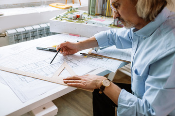 caucasian successful expert of engineering, senior architect in formal shirt work in office, have...