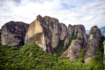 Legendary aerial drone view of ancient monasteries and breathtaking picturesque valley and landmark canyon of Meteora, Greece, Unesco
