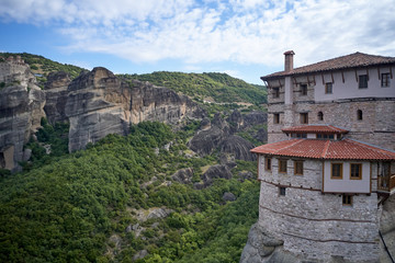 Legendary aerial drone view of ancient monasteries and breathtaking picturesque valley and landmark canyon of Meteora, Greece, Unesco