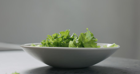 frisee salad leaves in white bowl