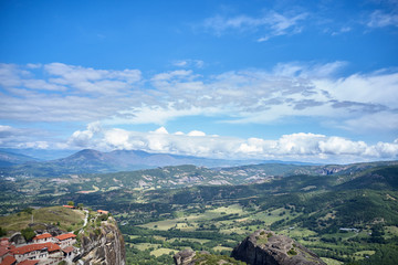 Legendary aerial drone view of ancient monasteries and breathtaking picturesque valley and landmark canyon of Meteora, Greece, Unesco