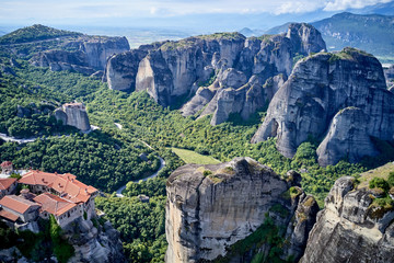 Legendary aerial drone view of ancient monasteries and breathtaking picturesque valley and landmark canyon of Meteora, Greece, Unesco