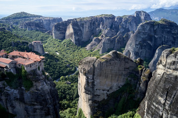 Legendary aerial drone view of ancient monasteries and breathtaking picturesque valley and landmark canyon of Meteora, Greece, Unesco
