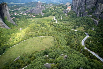 Legendary aerial drone view of ancient monasteries and breathtaking picturesque valley and landmark canyon of Meteora, Greece, Unesco