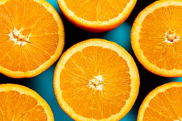 oranges in the cut on a blue background.