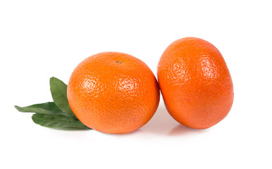 Tangerine, clementine with green leaves isolated clipping path