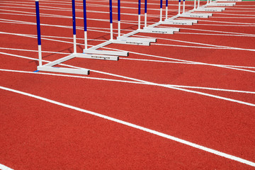 Hurdle bracket on red plastic runway