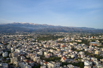 Panoramic aerial view from above of the city of Chania, Crete island, Greece with white mountains, beautiful venetian town Chania in Crete island. Chania, Crete, Greece.