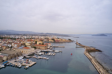 Panoramic drone aerial view from above of the city of Chania, Crete island, Greece. Landmarks of Greece, beautiful venetian town Chania in Crete island. Chania, Crete, Greece.