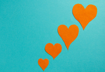 orange hearts on a blue background.