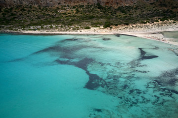 Amazing aerial drone top panoramic view on the famous Balos beach in Balos lagoon and pirate island Gramvousa. Place of the confluence of three seas. Balos beach, Chania. Crete island. Greece. Europe.