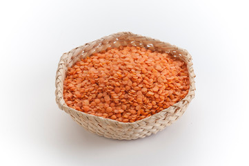 orange toor daal lentils in bamboo bowl