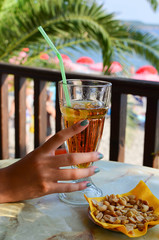 Beach bar refreshing, ice tea and peanuts