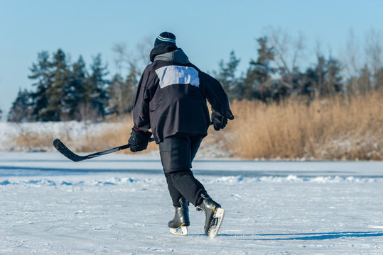 Playing Ice Street Hockey On The Frozen Lake